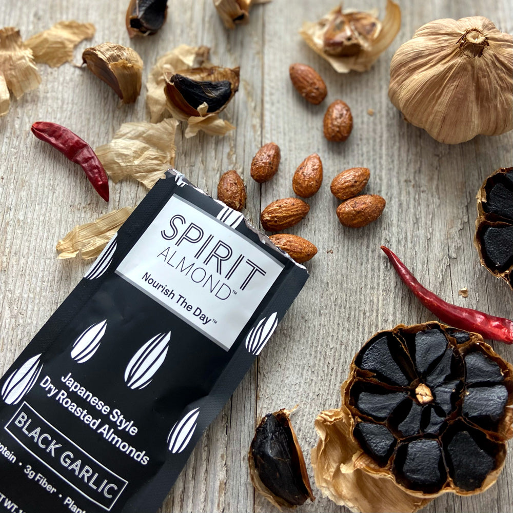 SPIRIT Almond Japanese Style Dry Roasted Almonds, Black Garlic, single serving bag, almonds, black garlic cloves, and dried hot pepper.