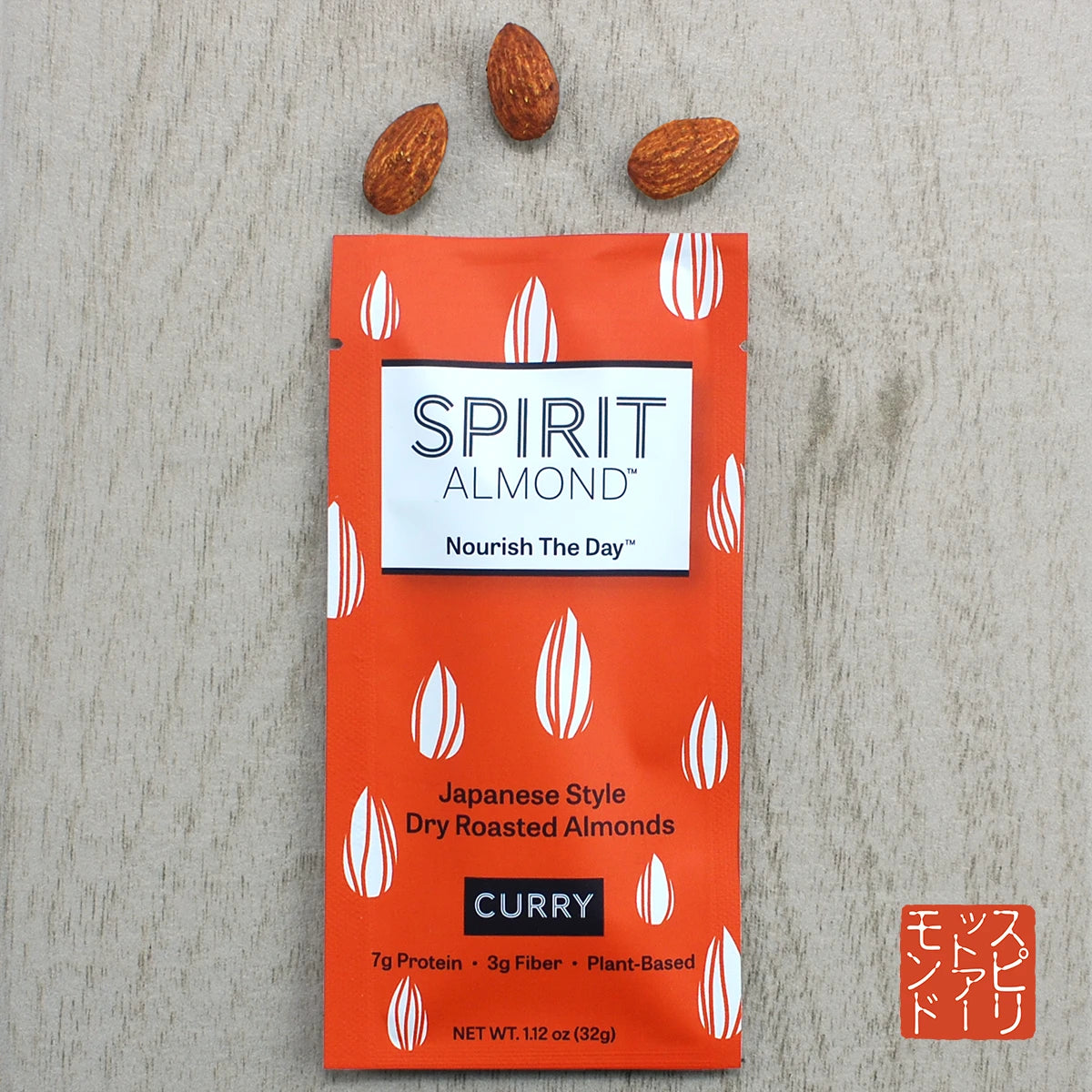 Package of SPIRIT Almond Curry flavor, with a few almonds displayed