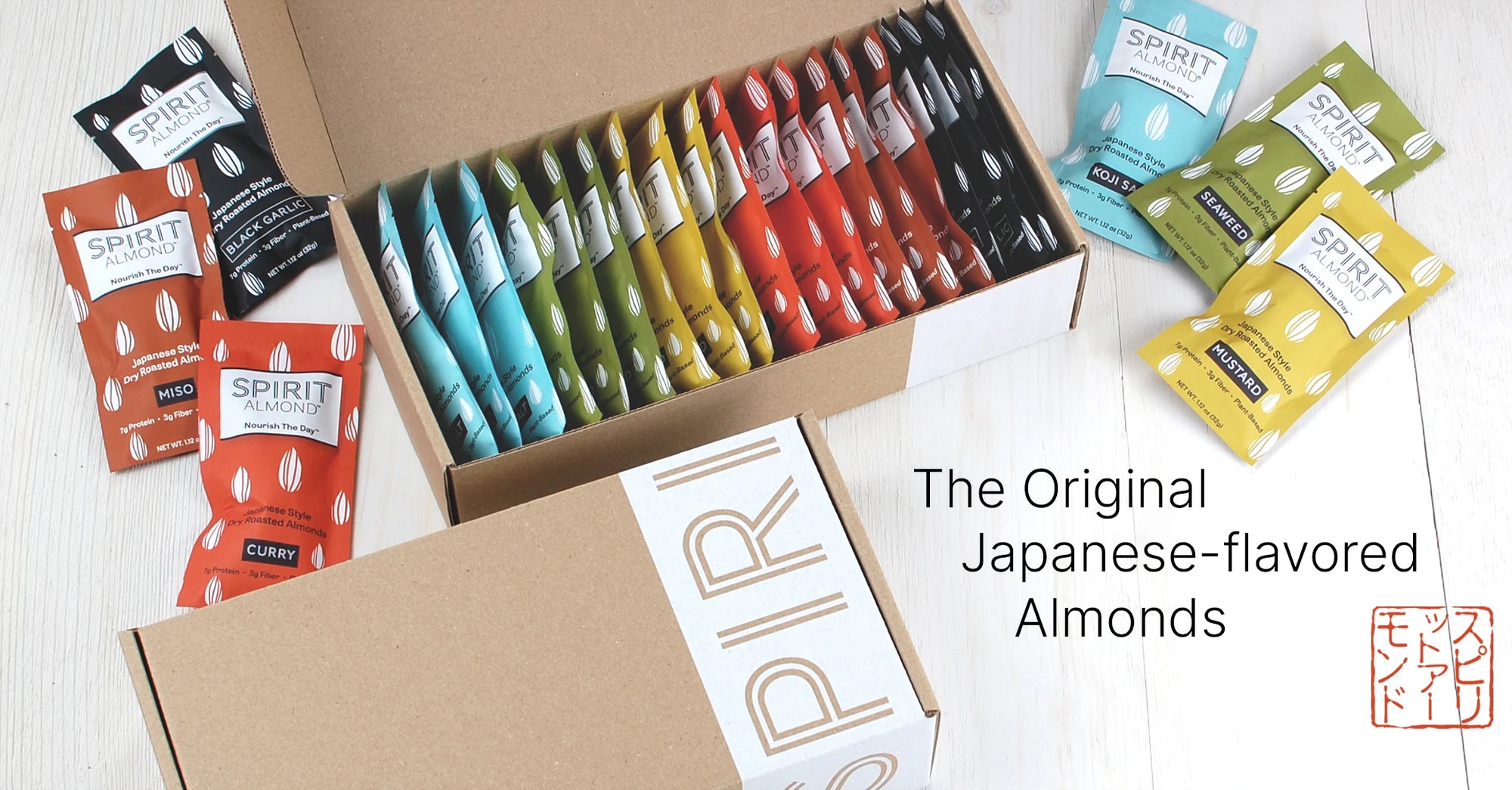 Open and closed boxes of SPIRIT Almond with colorful assortment of packages. Caption: The Original Japanese-flavored Almonds