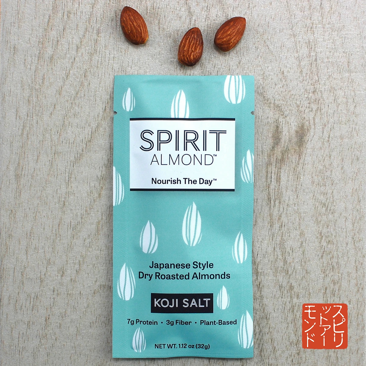 Package of SPIRIT Almond Koji Salt flavor, with a few almonds displayed