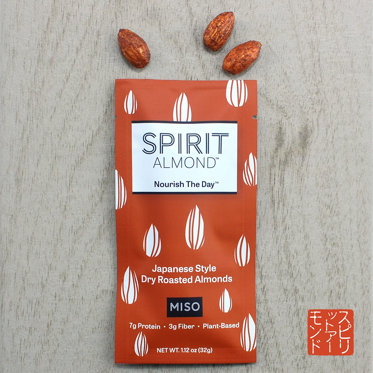 Package of SPIRIT Almond Miso flavor, with a few almonds displayed