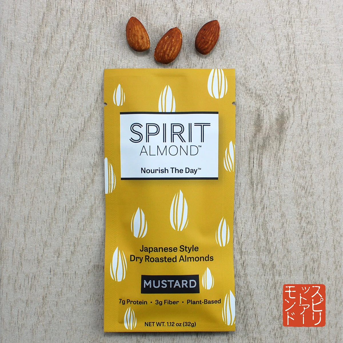 Package of SPIRIT Almond Mustard flavor, with a few almonds displayed